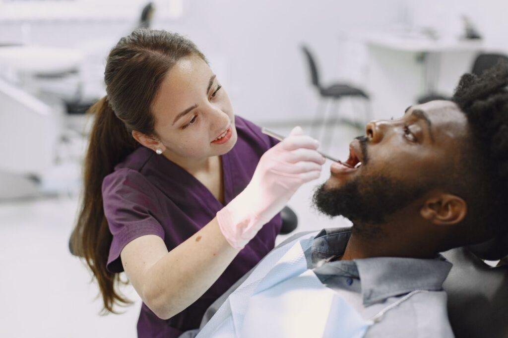 Dental professional discussing dry mouth and saliva health with a patient in Richmond Hill