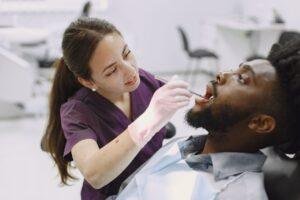 Dental professional discussing dry mouth and saliva health with a patient in Richmond Hill