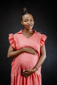 Smiling pregnant woman planning a safe dental visit in Richmond Hill