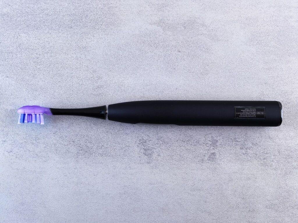 Electric toothbrush on a bathroom counter