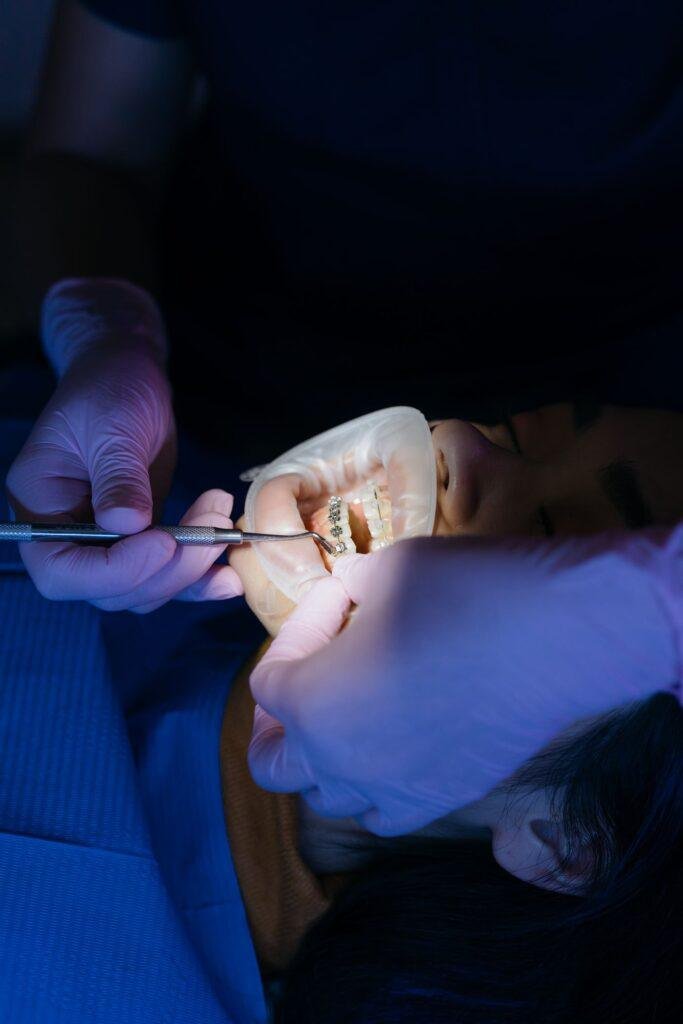 Dentist examining a patient teeth for cavities