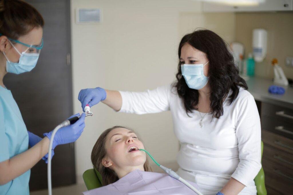 Patient in a dental chair receiving gentle restorative care