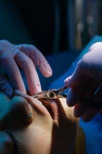Dentist examining a patient with a grey discoloured tooth in Richmond Hill