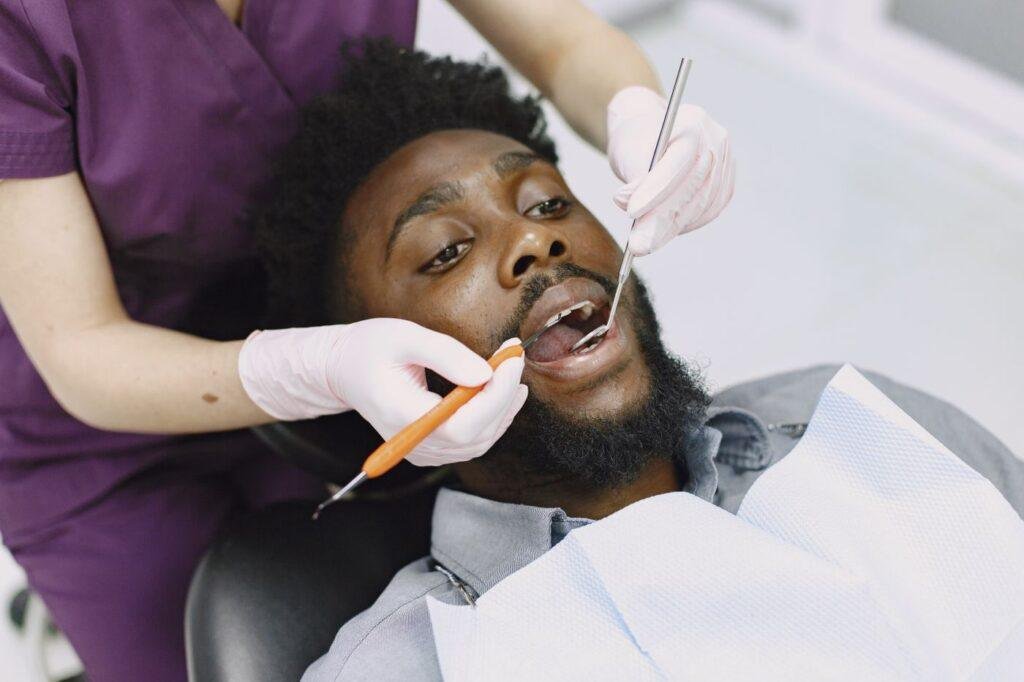 Dentist examining a patient teeth and gums during a checkup