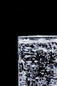 Close-up of a glass of sparkling water with bubbles