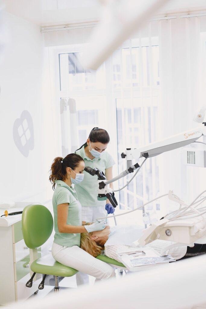 Dental team performing a procedure in a bright modern clinic