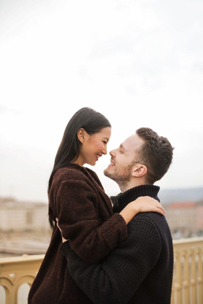 Smiling couple embracing, feeling confident and relaxed together