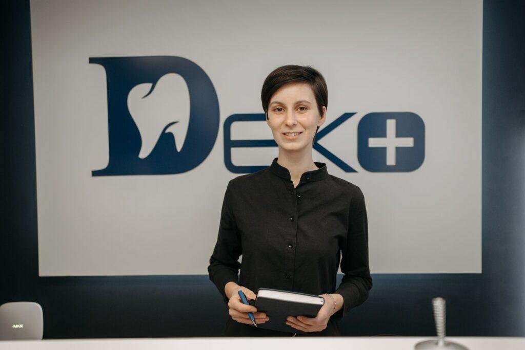 Smiling dentist ready to discuss partial denture options with a patient